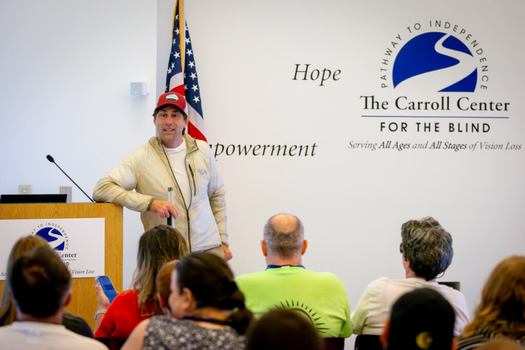 Erik Weihenmayer speaks to students entering the summer program at the Carroll Center for the Blind on Monday.