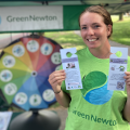 Green Newton volunteer Lucy Johnson with door-hangers for the heat-pump campaign (photo: Green Newton)