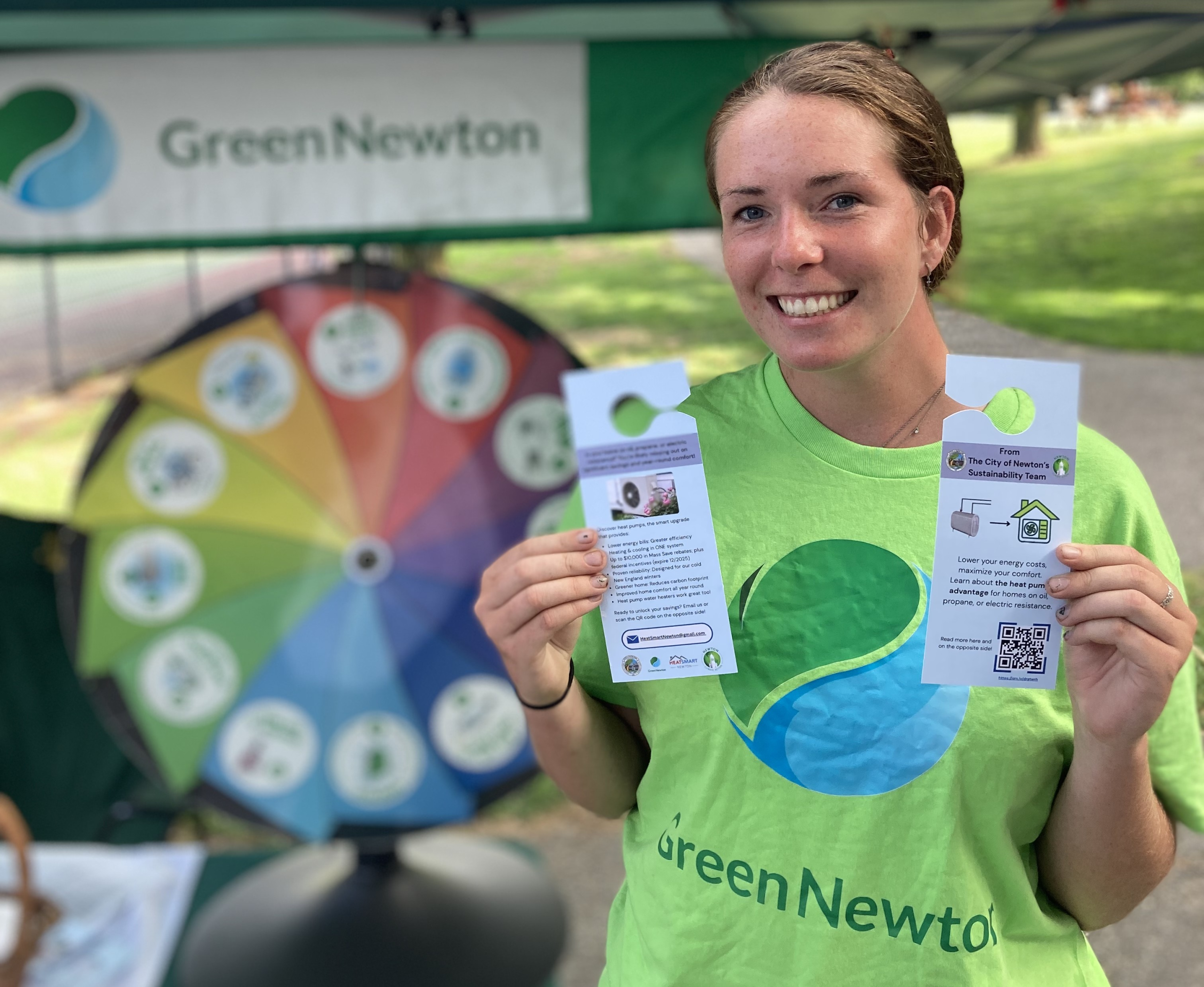 Green Newton volunteer Lucy Johnson with door-hangers for the heat-pump campaign (photo: Green Newton)